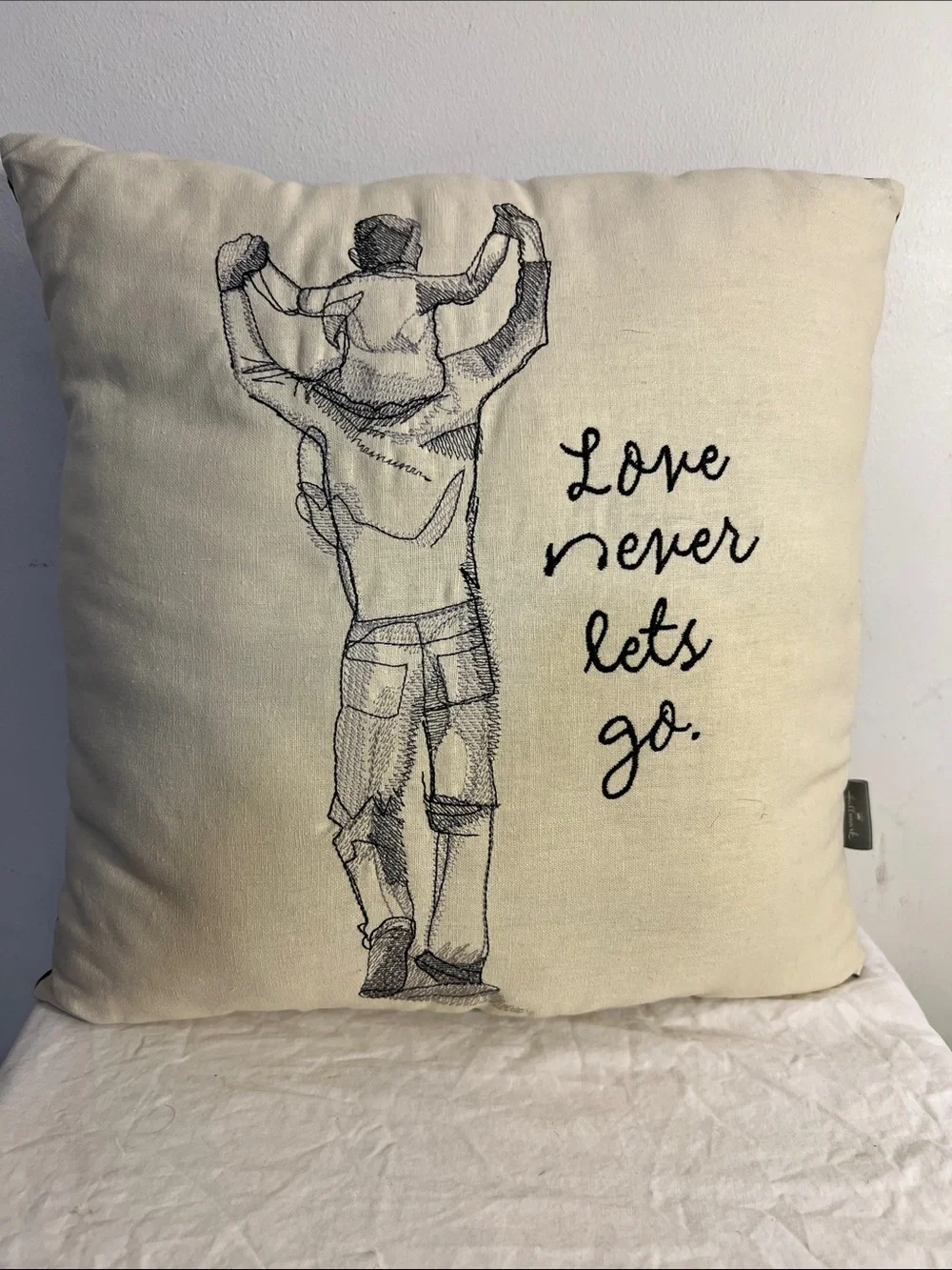 Ken Sheldon Embroidered Love Never Lets Go Cream Home Decor Pillow